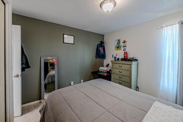 bedroom featuring a textured ceiling