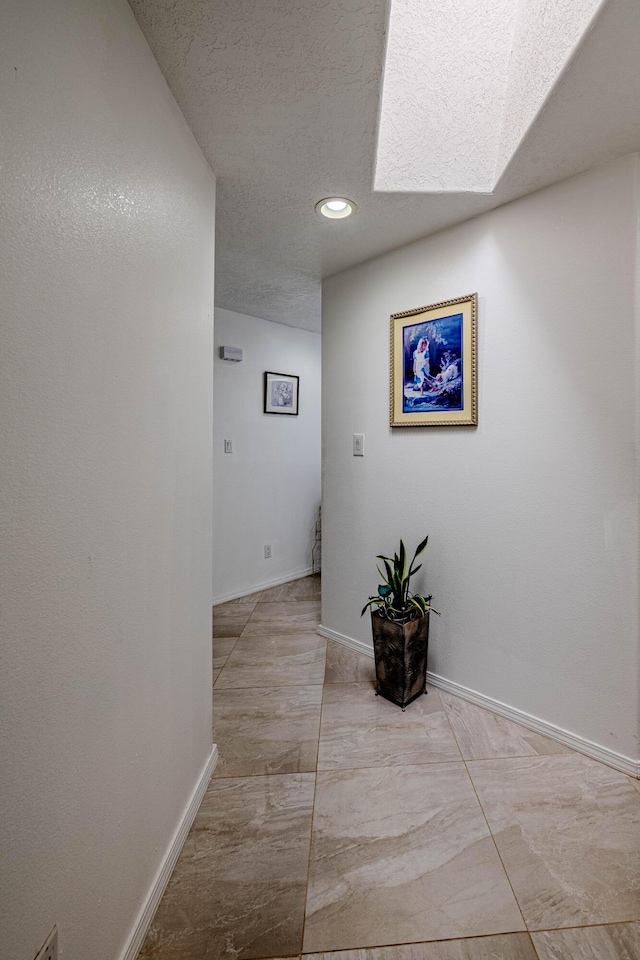 hall featuring a skylight