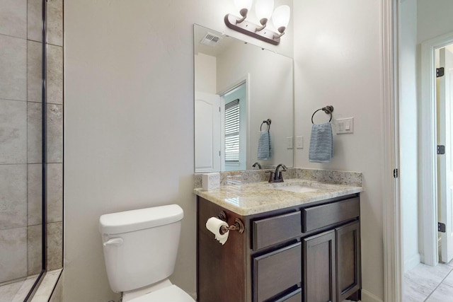 full bathroom with toilet, visible vents, a tile shower, and vanity