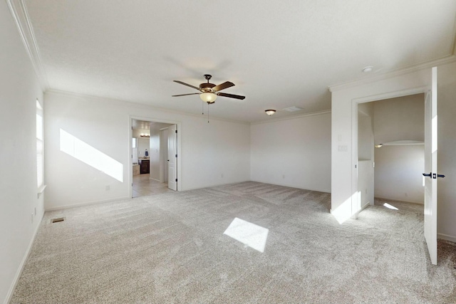 unfurnished room with ceiling fan, visible vents, ornamental molding, and light colored carpet