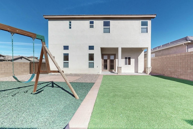 back of property featuring a patio, a fenced backyard, and stucco siding