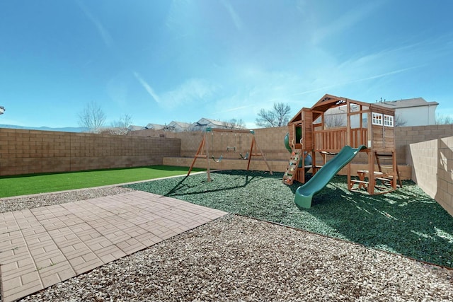 view of play area featuring a patio area and a fenced backyard