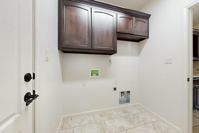 laundry room with cabinet space, light tile patterned floors, baseboards, hookup for an electric dryer, and washer hookup