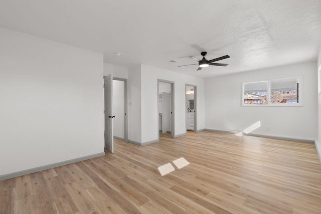 unfurnished room with ceiling fan and light hardwood / wood-style flooring