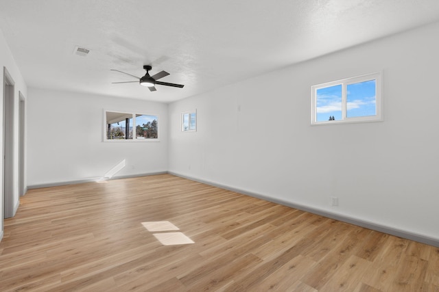 spare room featuring ceiling fan and light wood-type flooring