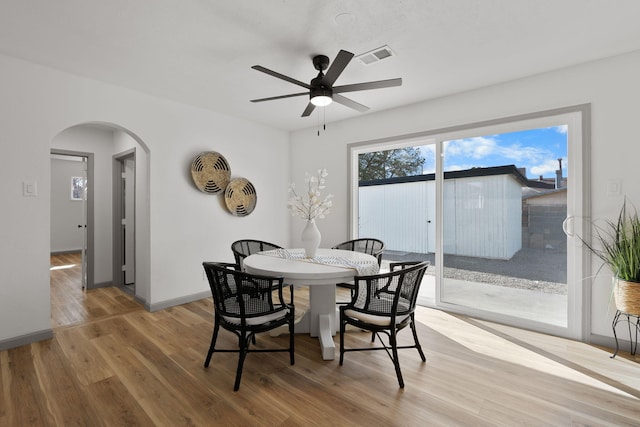 dining room with ceiling fan and hardwood / wood-style floors