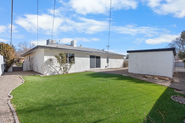 rear view of property with a yard