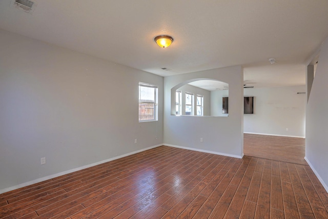 spare room featuring dark hardwood / wood-style flooring