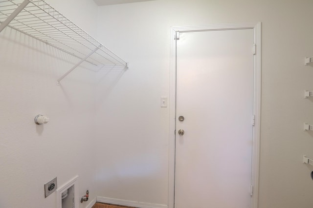 clothes washing area featuring hookup for a gas dryer and hookup for an electric dryer