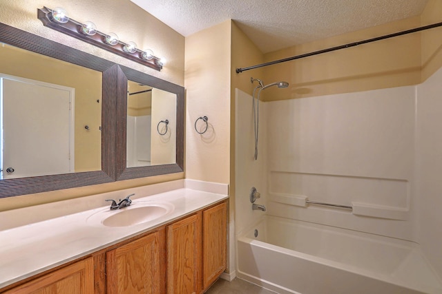 bathroom featuring vanity, tile patterned floors, a textured ceiling, and shower / bath combination