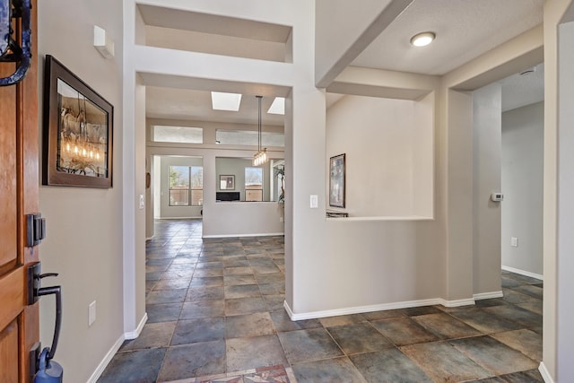 entrance foyer featuring a skylight