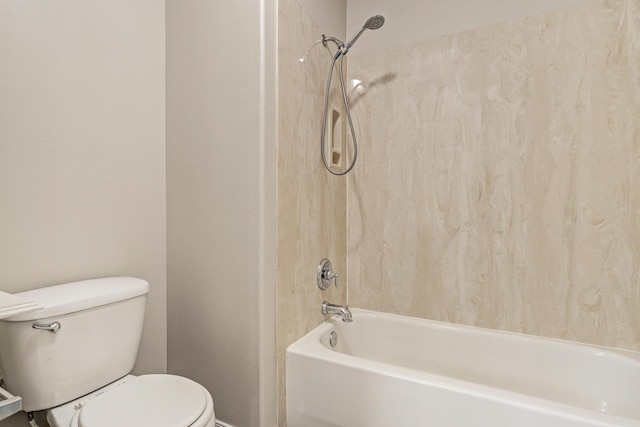 bathroom featuring shower / washtub combination and toilet