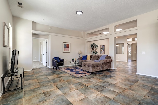 living room with a textured ceiling