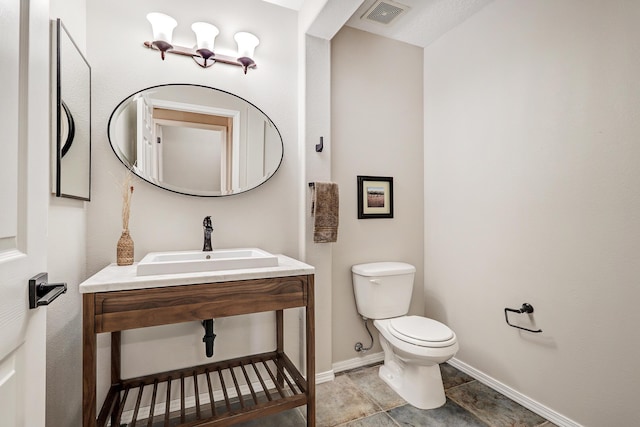 bathroom with sink and toilet