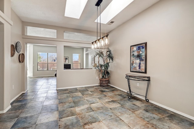 unfurnished dining area with a skylight