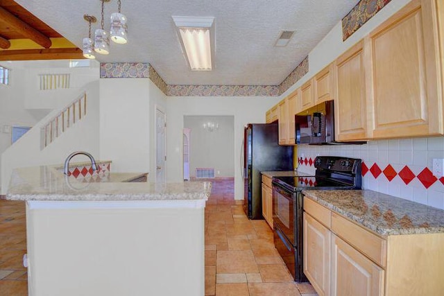 kitchen featuring hanging light fixtures, black appliances, a textured ceiling, light brown cabinetry, and decorative backsplash