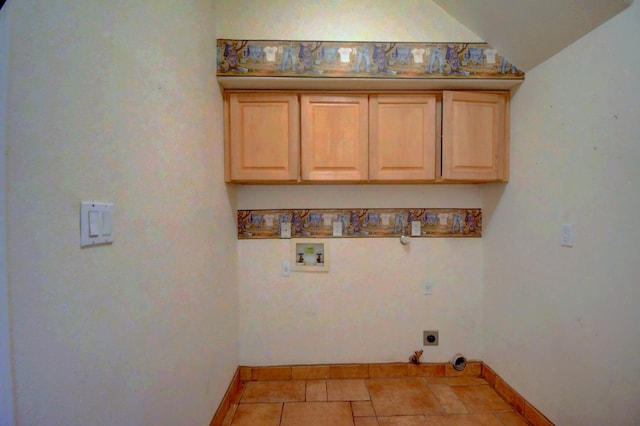 laundry area featuring electric dryer hookup, hookup for a washing machine, and cabinets