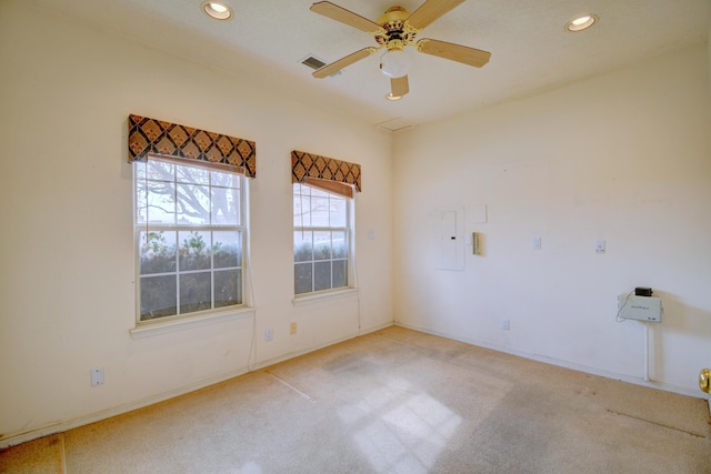 unfurnished room with light carpet and ceiling fan