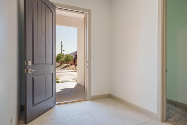 entrance foyer with light tile patterned floors