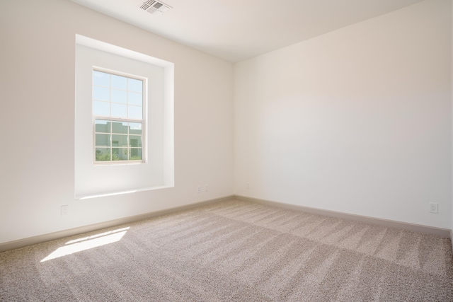 unfurnished room with carpet floors