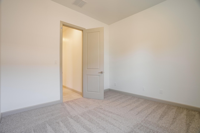 empty room with light colored carpet