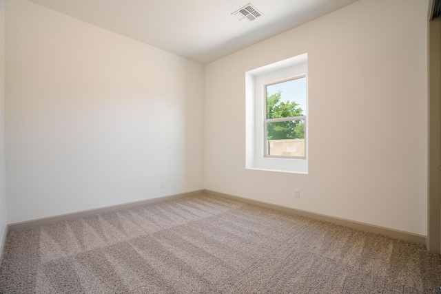 unfurnished room featuring carpet