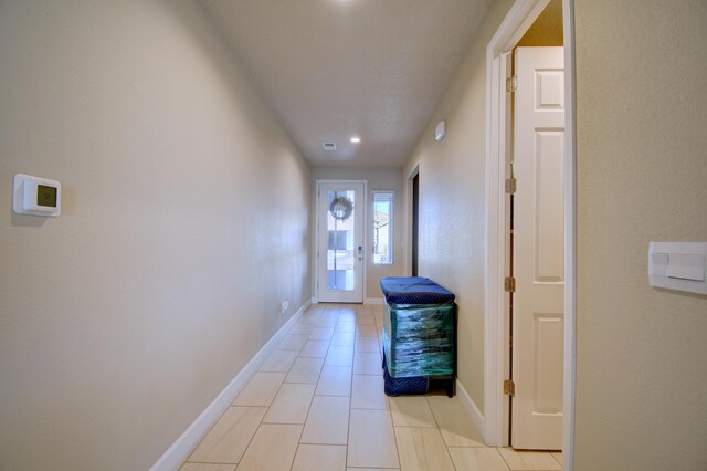 entryway featuring light tile patterned flooring