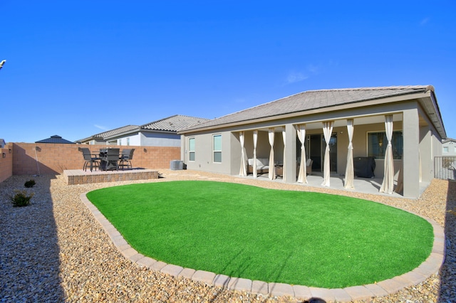 rear view of property with a patio area and central air condition unit