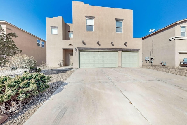 southwest-style home with a garage