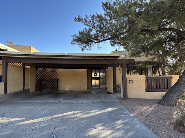 view of front of property with a carport