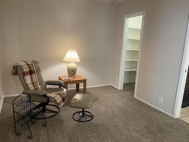 sitting room featuring carpet floors