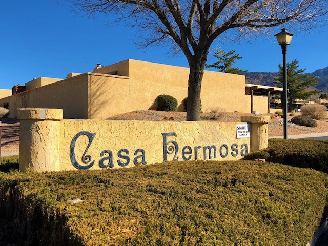 community / neighborhood sign featuring a mountain view