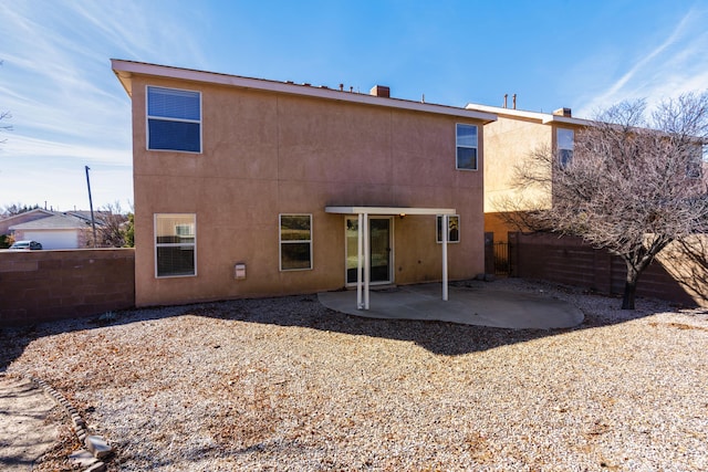 back of property featuring a patio