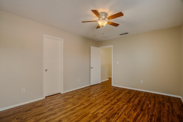 unfurnished room with hardwood / wood-style floors and ceiling fan