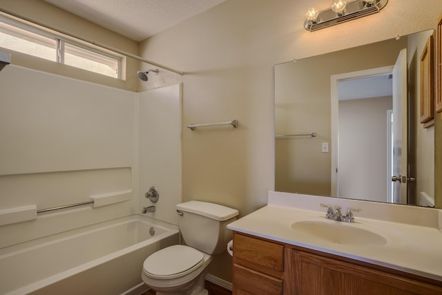 full bathroom featuring toilet, vanity, bathtub / shower combination, and a textured ceiling