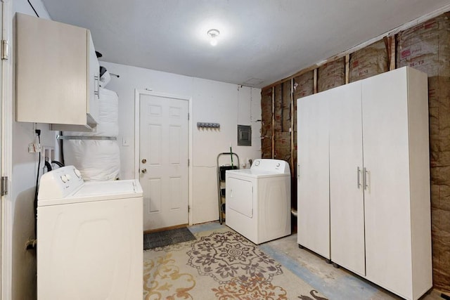 laundry area featuring washing machine and dryer and cabinet space