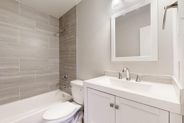 full bath featuring toilet,  shower combination, and vanity