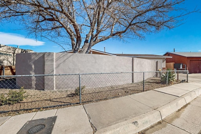 view of home's exterior featuring fence private yard and stucco siding