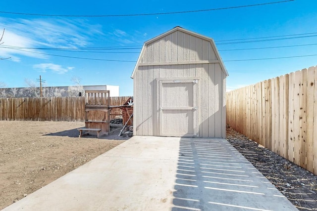 view of shed featuring a fenced backyard