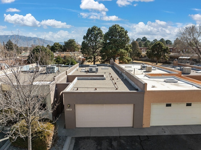 birds eye view of property with a mountain view