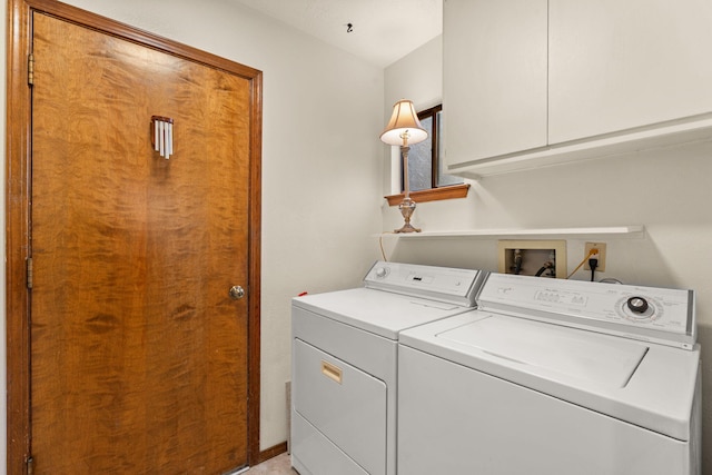 laundry area with cabinets and washing machine and dryer