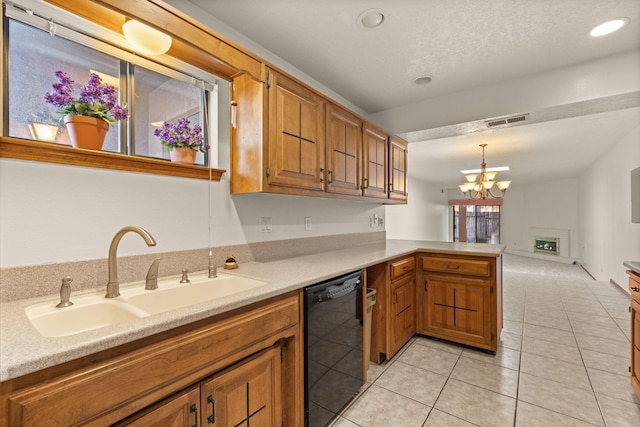 kitchen with pendant lighting, dishwasher, sink, light tile patterned floors, and kitchen peninsula