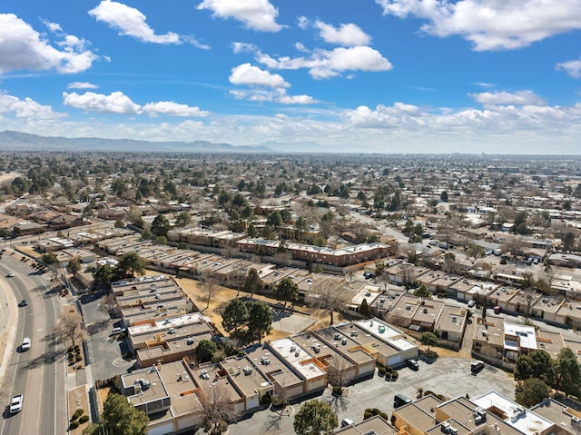 birds eye view of property with a mountain view