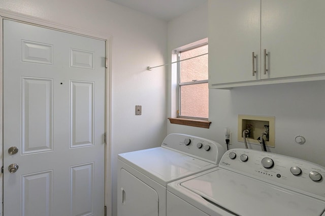 laundry area with cabinets and washing machine and dryer