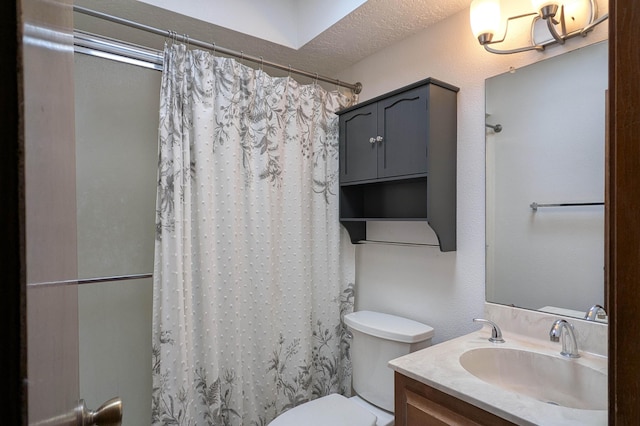 bathroom featuring vanity, a shower with curtain, and toilet