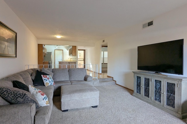 living room with light colored carpet