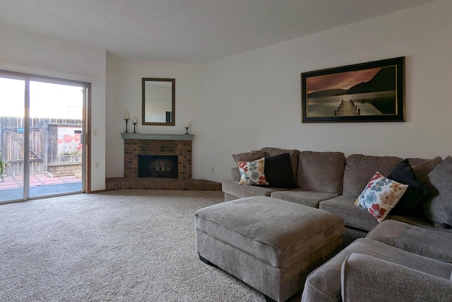 carpeted living room featuring a brick fireplace