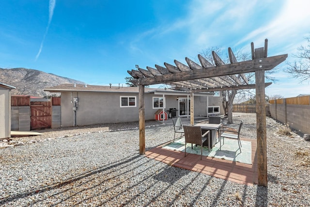 view of patio / terrace with a mountain view, a pergola, and grilling area