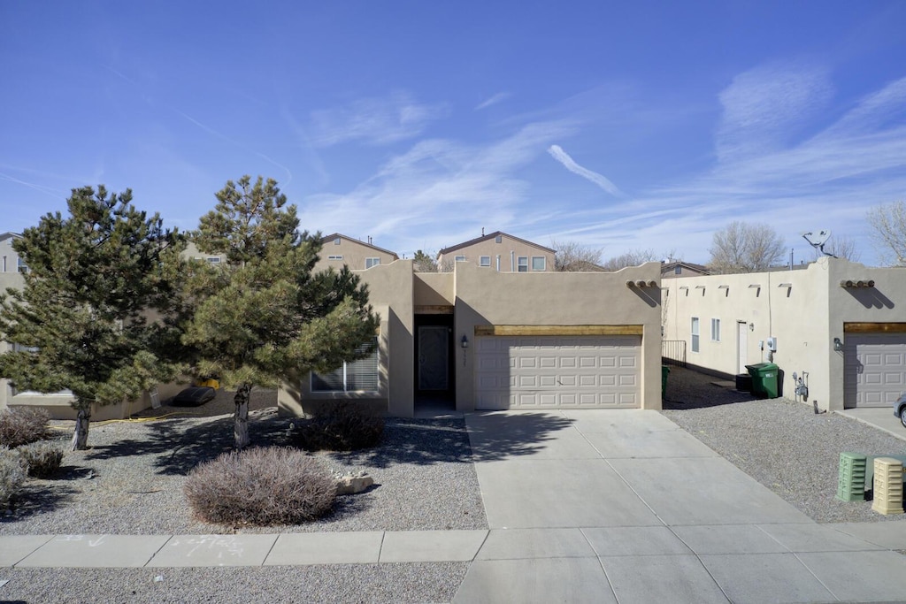 adobe home featuring a garage