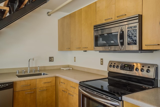 kitchen featuring appliances with stainless steel finishes and sink